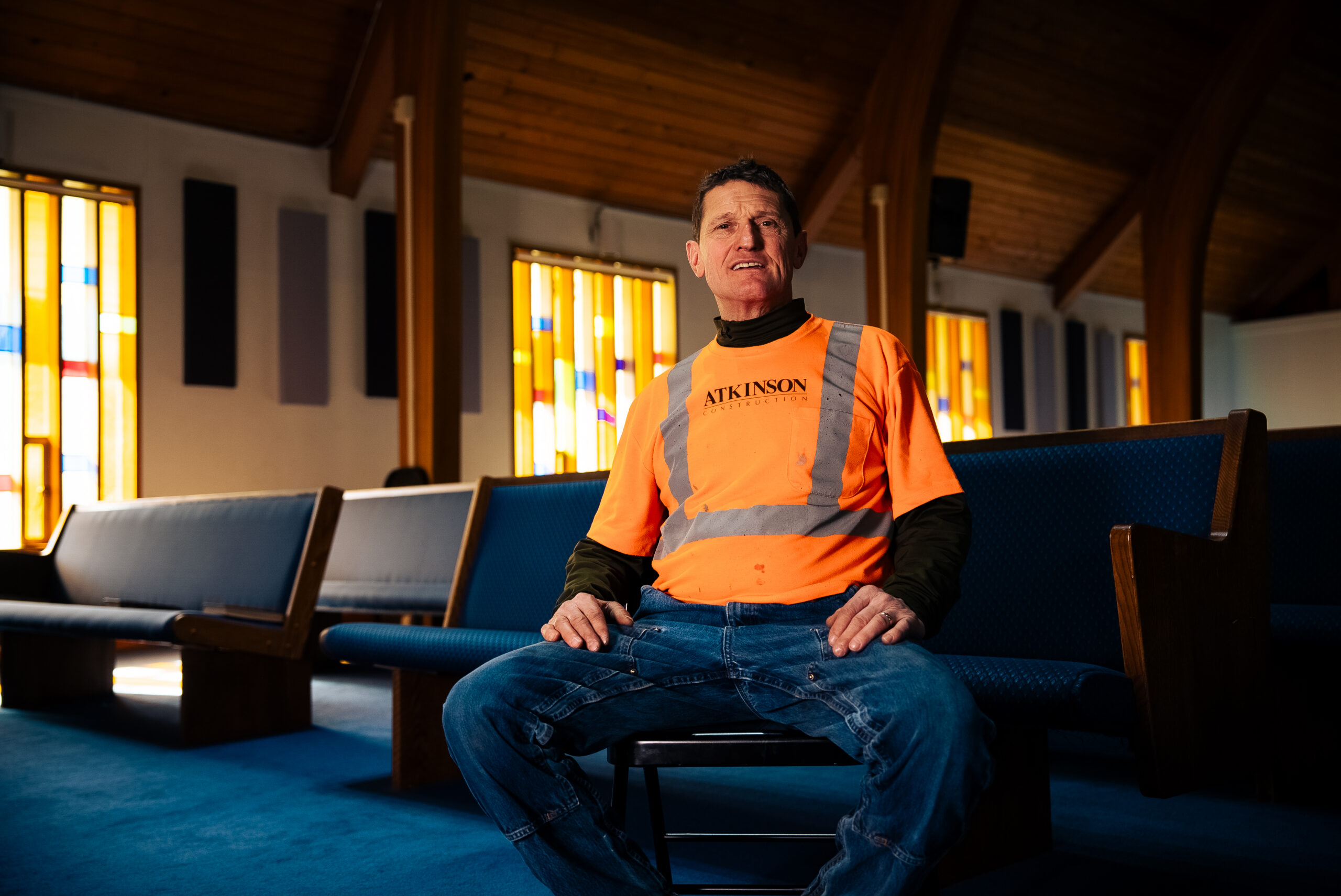 Mac sitting on a church pew
